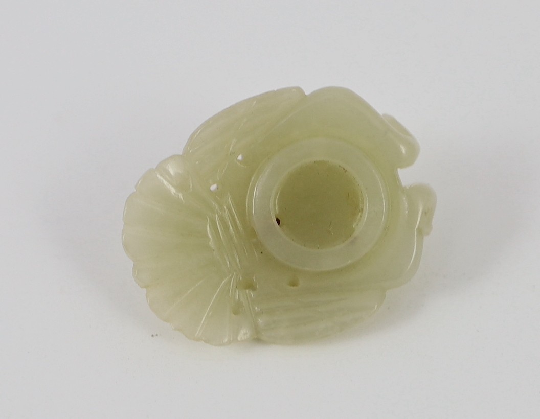 A Chinese pale celadon jade mount carved as a mythical half-man half-bird creature, 18th/19th century, 3.8cm high